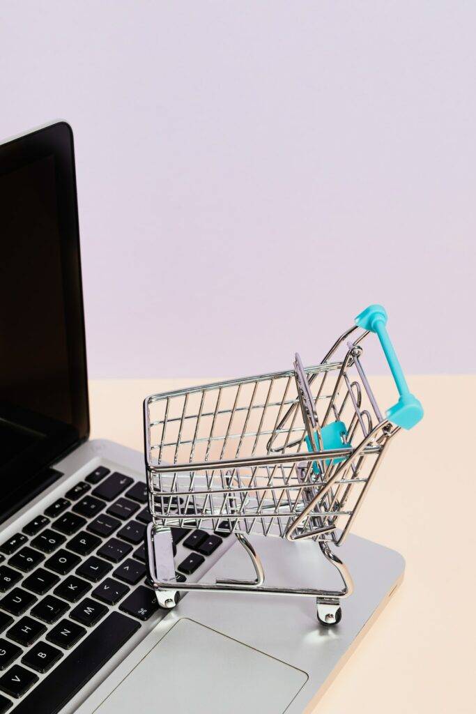 Mini shopping basket on a laptop